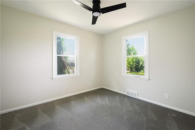 11524 Sunnyslope Dr, Kansas City, MO 64134 - empty room featuring dark carpet, baseboards, and ceiling fan