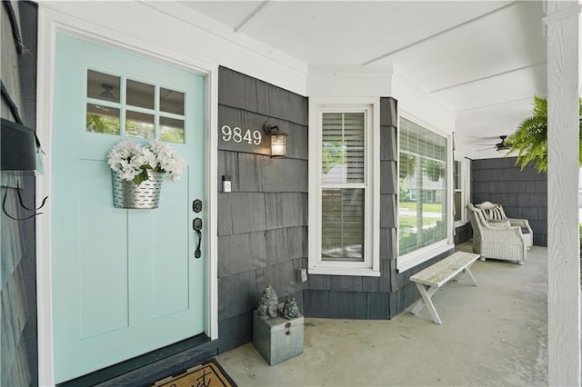 9849 Riggs St, Overland Park, KS 66212 - view of exterior entry with a porch
