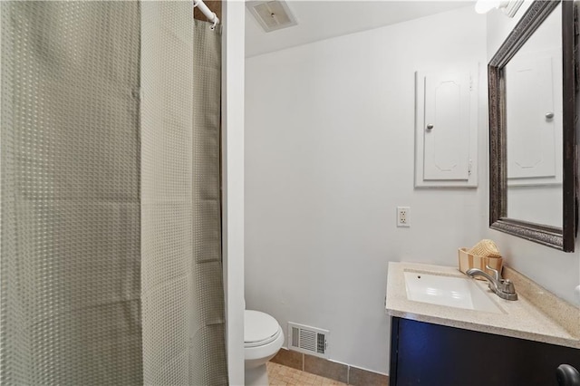 9849 Riggs St, Overland Park, KS 66212 - full bathroom with vanity, toilet, a shower with shower curtain, and tile patterned flooring
