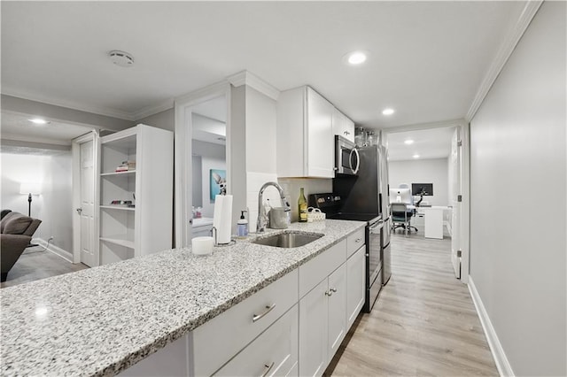 9849 Riggs St, Overland Park, KS 66212 - kitchen with black electric range, stainless steel microwave, a sink, light stone countertops, and white cabinets