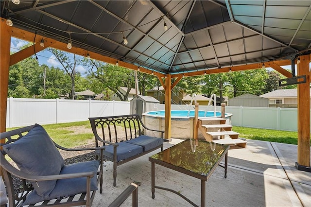 9849 Riggs St, Overland Park, KS 66212 - fenced backyard featuring a gazebo, a patio area, and a shed