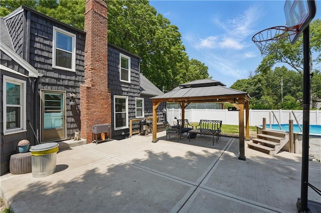 9849 Riggs St, Overland Park, KS 66212 - fenced backyard with a gazebo, a patio area, and an outdoor living space