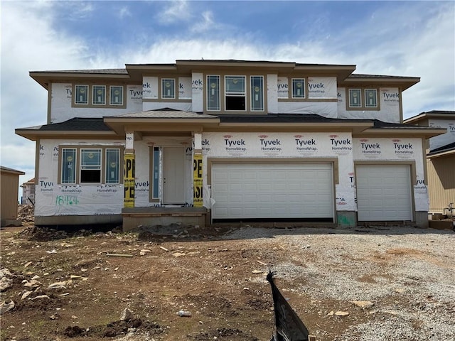 view of front of house featuring an attached garage and driveway