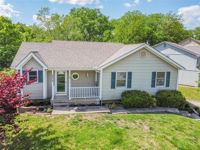 6476 NW Valley Dr, Parkville, MO 64152 - single story home featuring covered porch, a front lawn, and a shingled roof