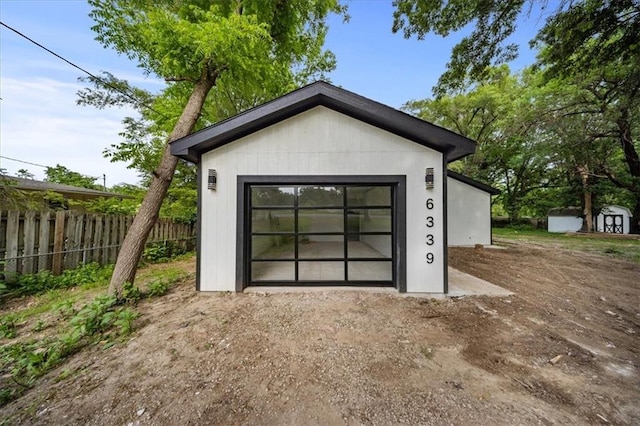 6339 Harris Ave, Raytown, MO 64133 - garage with a shed and driveway