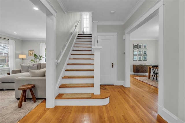 605 W 59th Ter, Kansas City, MO 64113 - staircase with wood finished floors, plenty of natural light, crown molding, and recessed lighting