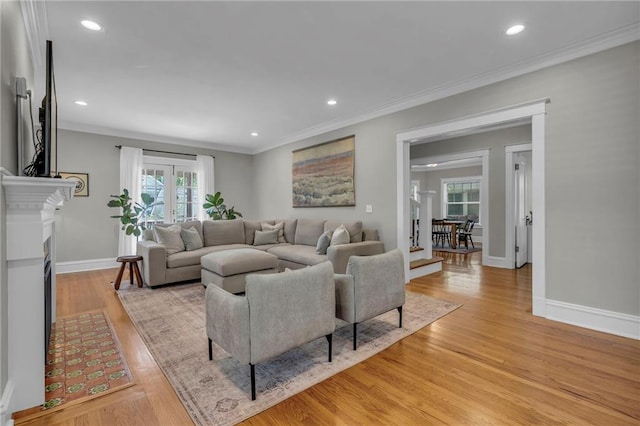 605 W 59th Ter, Kansas City, MO 64113 - living room featuring light wood-style floors, recessed lighting, ornamental molding, and french doors
