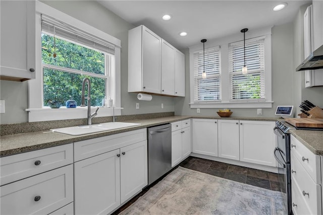 605 W 59th Ter, Kansas City, MO 64113 - kitchen featuring appliances with stainless steel finishes, white cabinets, recessed lighting, hanging light fixtures, and dark stone finish floors