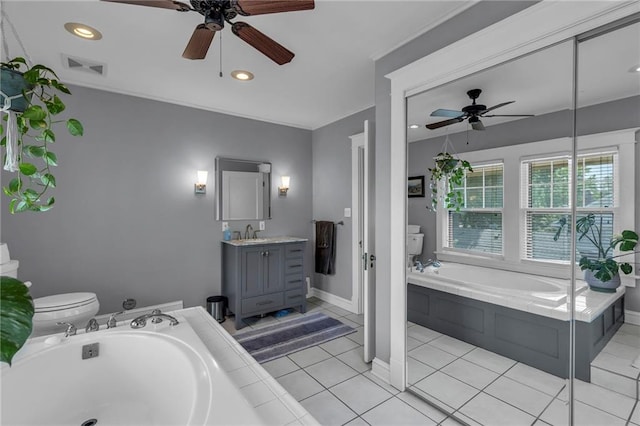 605 W 59th Ter, Kansas City, MO 64113 - full bath featuring a ceiling fan, vanity, a garden tub, tile patterned flooring, and recessed lighting