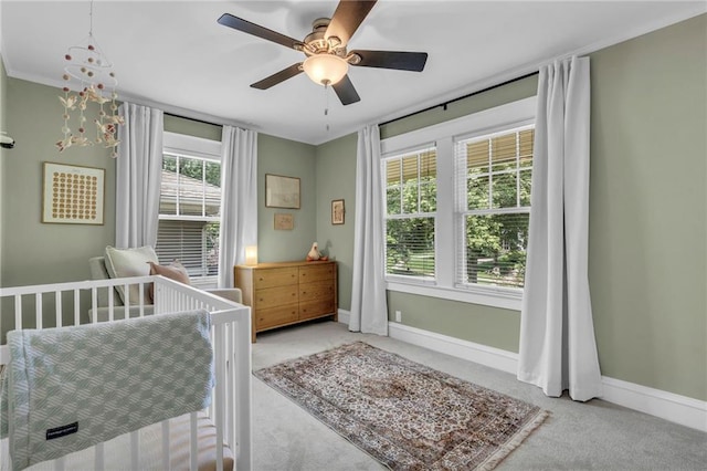 605 W 59th Ter, Kansas City, MO 64113 - carpeted bedroom featuring baseboards and ceiling fan