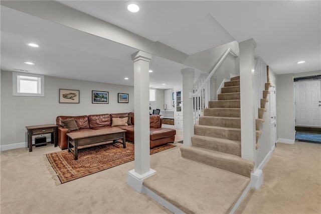 605 W 59th Ter, Kansas City, MO 64113 - living room with light carpet, recessed lighting, stairs, and decorative columns