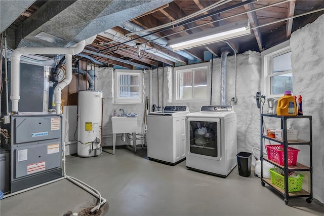 605 W 59th Ter, Kansas City, MO 64113 - basement with gas water heater, washer and clothes dryer, and heating unit