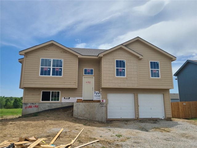 1921 Eagle Dr, Harrisonville, MO 64701 - bi-level home featuring a garage