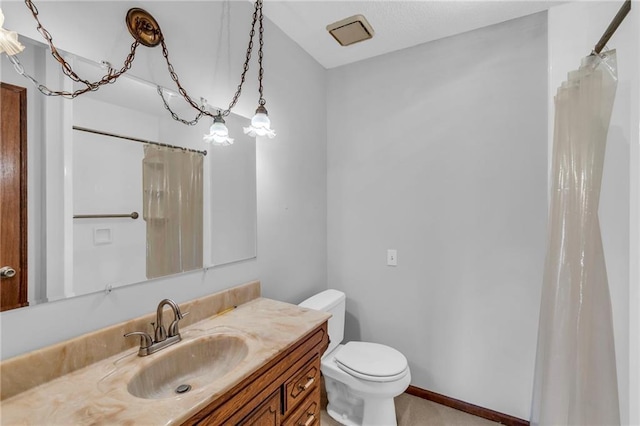 bathroom with vanity, toilet, and a shower with shower curtain