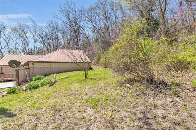 view of grassy yard featuring a deck