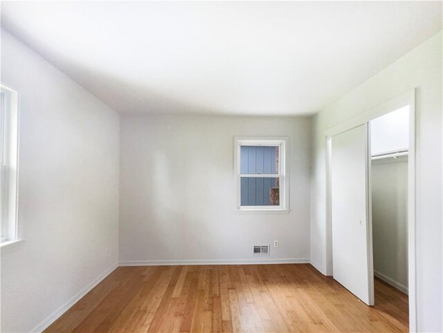 8412 E 103rd Ter, Kansas City, MO 64134 - unfurnished bedroom with light wood finished floors, baseboards, and a closet