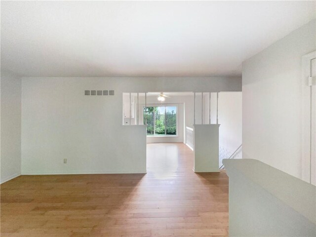 8412 E 103rd Ter, Kansas City, MO 64134 - unfurnished room featuring wood finished floors and ceiling fan