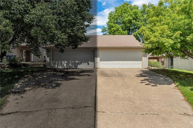 view of front of home featuring driveway and a garage