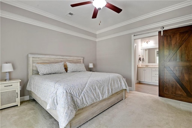 15908 Fontana St Unit 240, Overland Park, KS 66085 - bedroom featuring a barn door, light carpet, ornamental molding, connected bathroom, and a ceiling fan