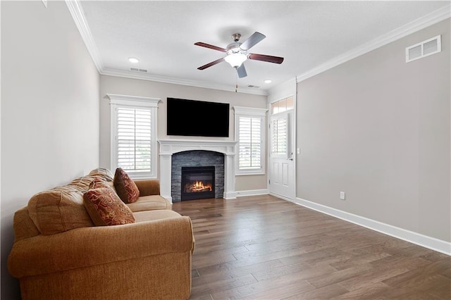 15908 Fontana St Unit 240, Overland Park, KS 66085 - living room featuring ceiling fan, ornamental molding, a glass covered fireplace, wood finished floors, and baseboards