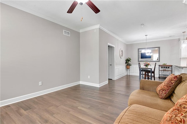 15908 Fontana St Unit 240, Overland Park, KS 66085 - living room featuring ceiling fan, ornamental molding, dark wood-type flooring, a chandelier, and baseboards