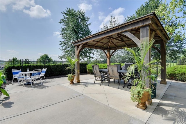 15908 Fontana St Unit 240, Overland Park, KS 66085 - view of patio with outdoor dining area, a gazebo, and fence