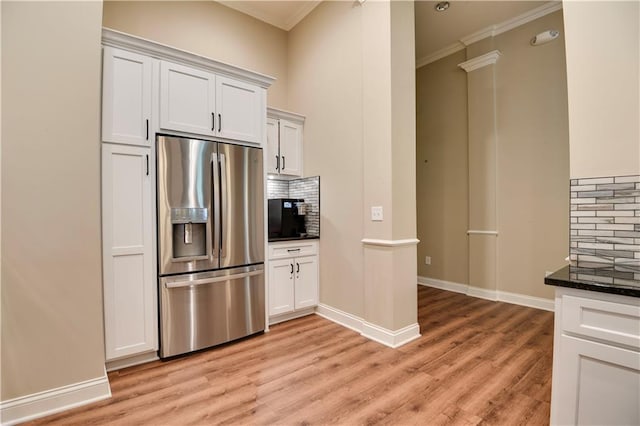 15908 Fontana St Unit 240, Overland Park, KS 66085 - kitchen with stainless steel fridge, crown molding, backsplash, light wood-style flooring, and white cabinets