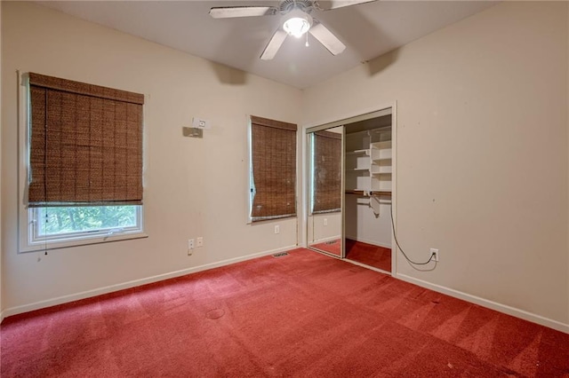 7100 N Cherry St, Gladstone, MO 64118 - unfurnished bedroom featuring carpet, baseboards, a closet, and a ceiling fan