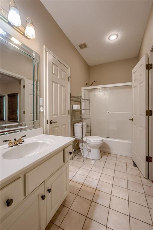 7100 N Cherry St, Gladstone, MO 64118 - full bath with vanity, tile patterned flooring, combined bath / shower with glass door, and toilet