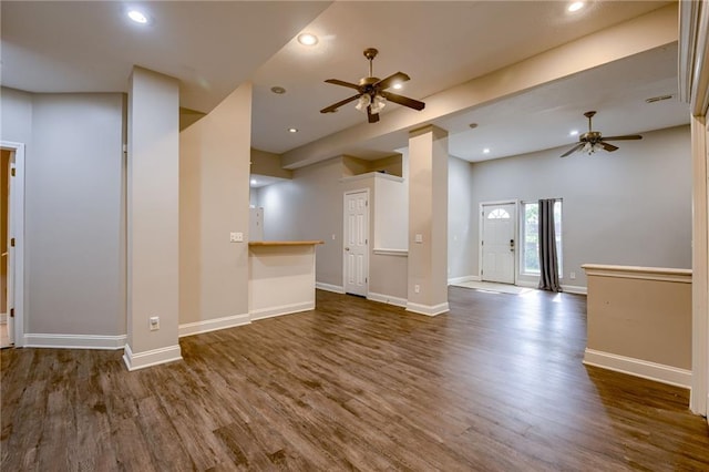 7100 N Cherry St, Gladstone, MO 64118 - unfurnished living room with a ceiling fan, dark wood finished floors, and recessed lighting