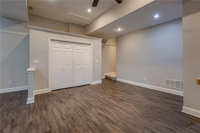 7100 N Cherry St, Gladstone, MO 64118 - unfurnished bedroom featuring dark wood-style flooring, baseboards, a ceiling fan, and recessed lighting
