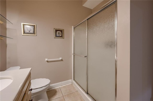 7100 N Cherry St, Gladstone, MO 64118 - bathroom with toilet, a stall shower, tile patterned flooring, and vanity