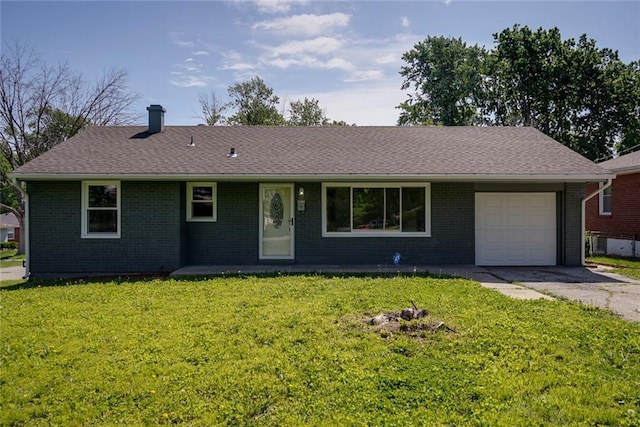 3001 S Hardy Ave, Independence, MO 64052 - single story home with a garage, brick siding, driveway, and a front yard