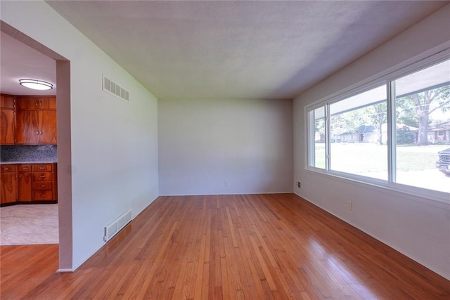 3001 S Hardy Ave, Independence, MO 64052 - empty room featuring light wood-type flooring