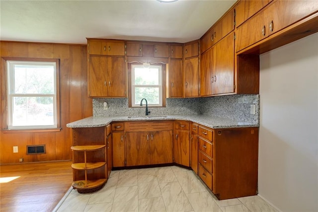 3001 S Hardy Ave, Independence, MO 64052 - kitchen with a sink, brown cabinets, and backsplash