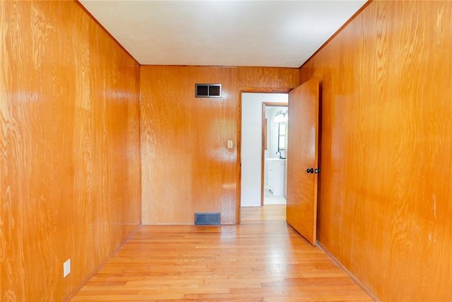 3001 S Hardy Ave, Independence, MO 64052 - empty room with wood finished floors and wooden walls
