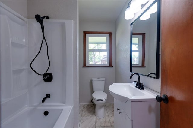 3001 S Hardy Ave, Independence, MO 64052 - full bath featuring toilet, vanity, marble look tile flooring, baseboards, and tub / shower combination