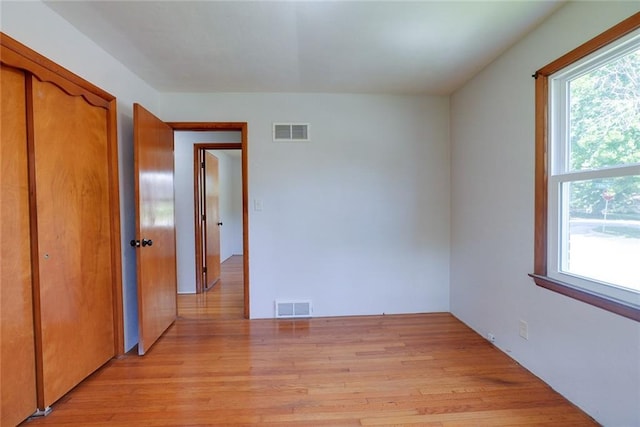 3001 S Hardy Ave, Independence, MO 64052 - spare room with light wood-style floors and healthy amount of natural light