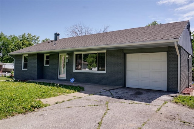 3001 S Hardy Ave, Independence, MO 64052 - ranch-style house featuring brick siding, driveway, a chimney, an attached garage, and covered porch