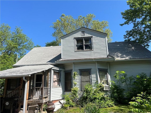 view of front of house with a shingled roof