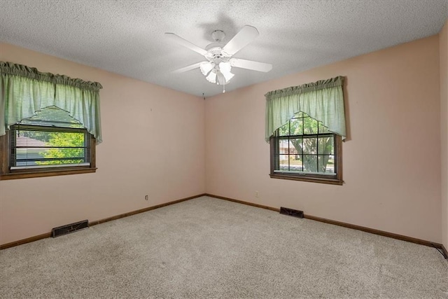 2107 N 154th Ter, Basehor, KS 66007 - carpeted spare room with baseboards, a ceiling fan, and a textured ceiling