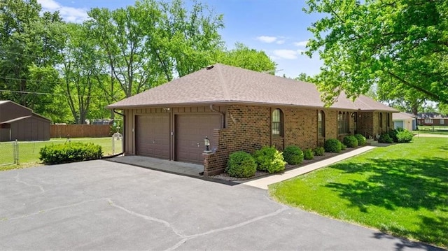 2107 N 154th Ter, Basehor, KS 66007 - view of property exterior featuring brick siding and roof with shingles