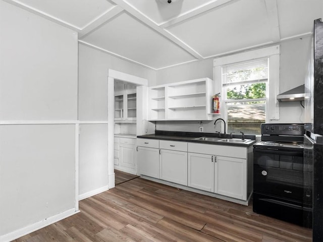 kitchen with black range with electric stovetop, a sink, wall chimney range hood, dark countertops, and dark wood-style floors
