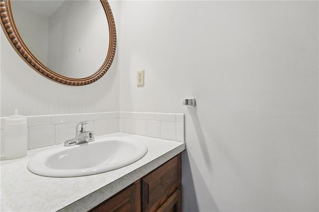 bathroom featuring decorative backsplash and vanity