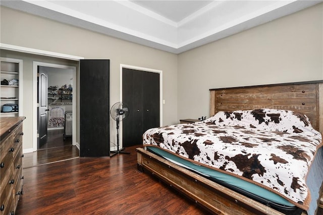 222 Prairie Ln, Wellsville, KS 66092 - bedroom with dark wood-style floors and a tray ceiling