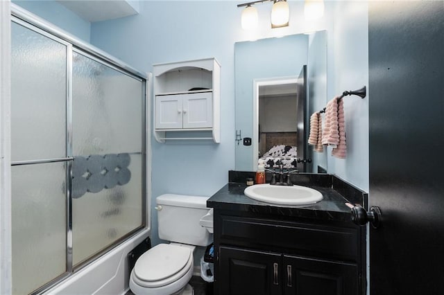 222 Prairie Ln, Wellsville, KS 66092 - full bath with vanity, bath / shower combo with glass door, and toilet