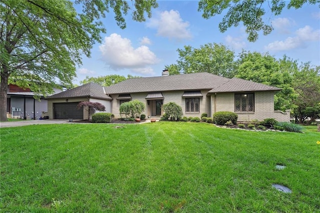 11203 Cedar St, Leawood, KS 66211 - ranch-style house featuring an attached garage, a front lawn, driveway, a chimney, and brick siding