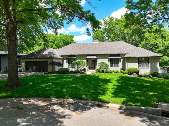11203 Cedar St, Leawood, KS 66211 - ranch-style house with an attached garage, a chimney, driveway, and a front lawn