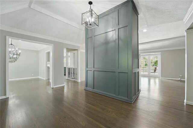11203 Cedar St, Leawood, KS 66211 - spare room featuring a chandelier, a textured ceiling, dark wood finished floors, baseboards, and ornamental molding