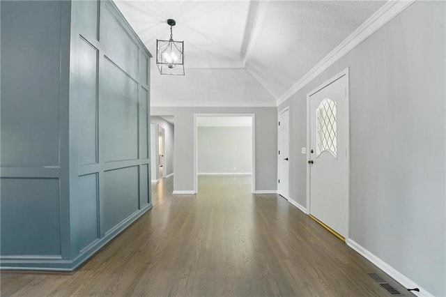 11203 Cedar St, Leawood, KS 66211 - entrance foyer with vaulted ceiling, a chandelier, dark wood-type flooring, baseboards, and ornamental molding